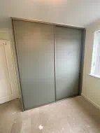 2 door reed green plain panel door wardrobes in brushed champagne frames, fitted in New Marske